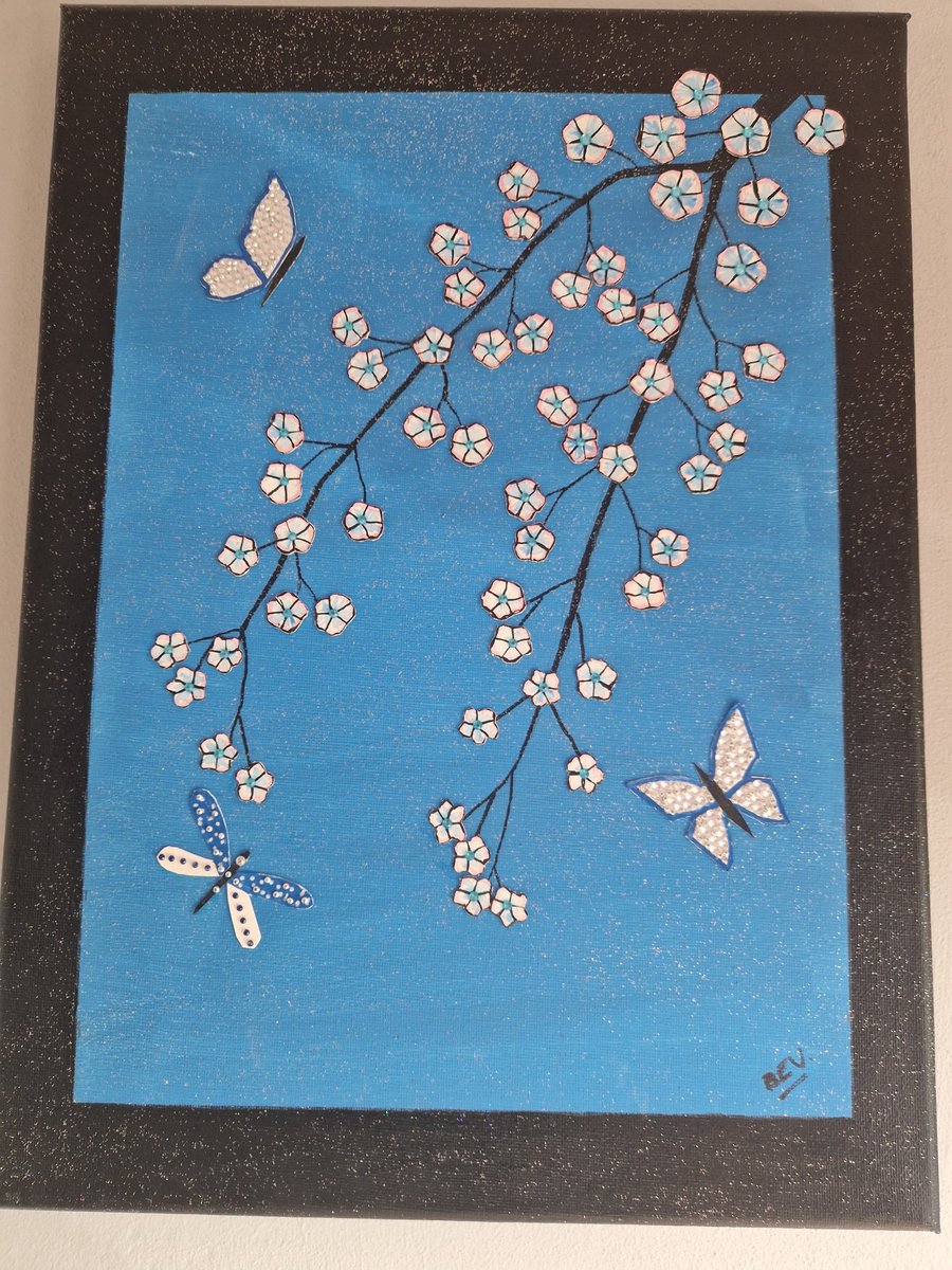 Blossoms and butterflies collage on canvas. 