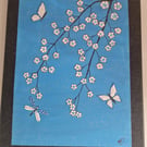 Blossoms and butterflies collage on canvas. 