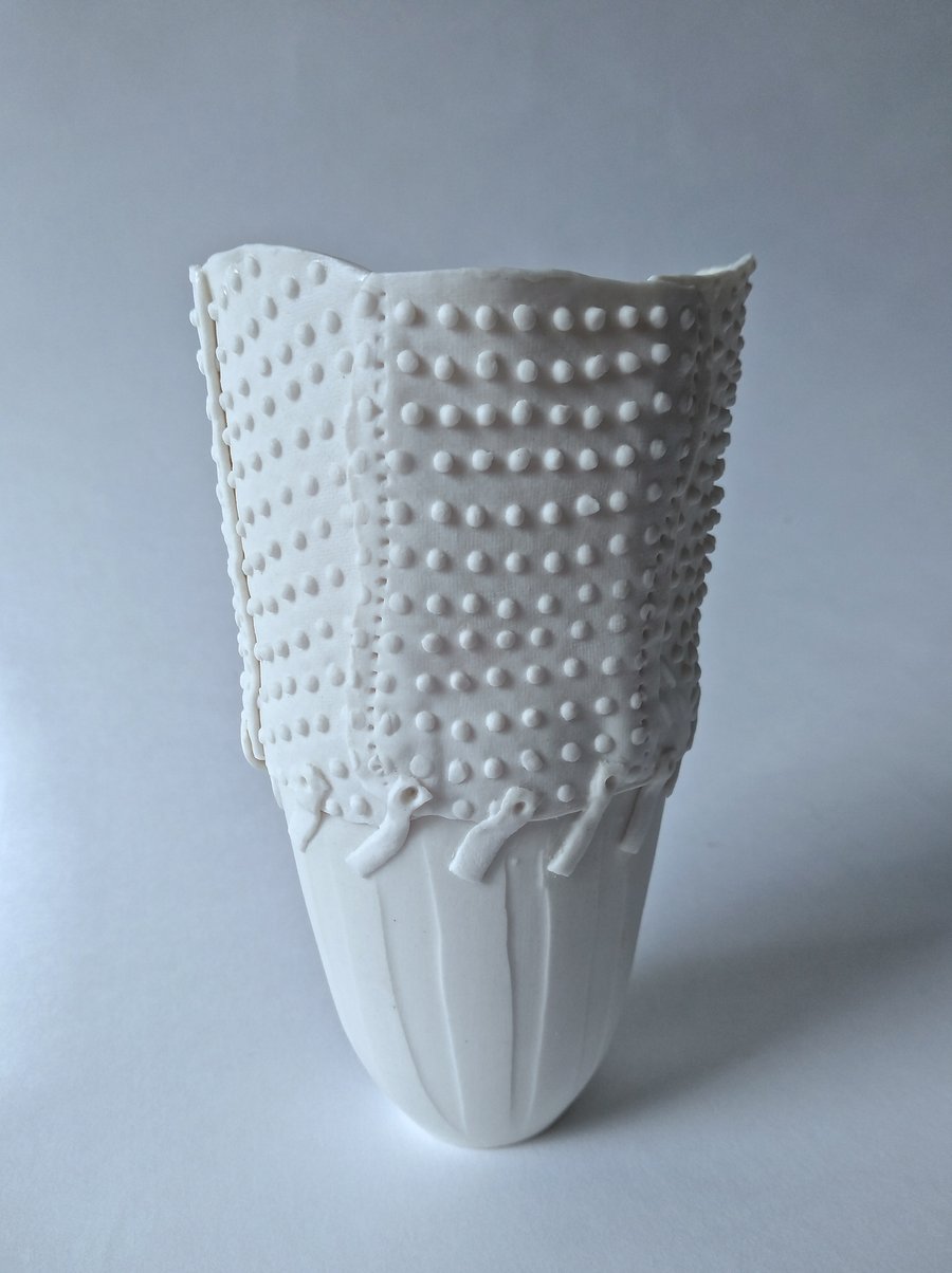 Delicate porcelain vase with impressed textures. Hand made by Linda.