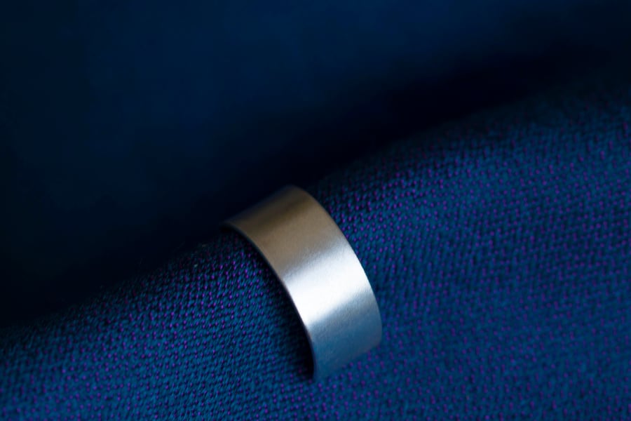 Slim silver ear cuff with a fine satin finish