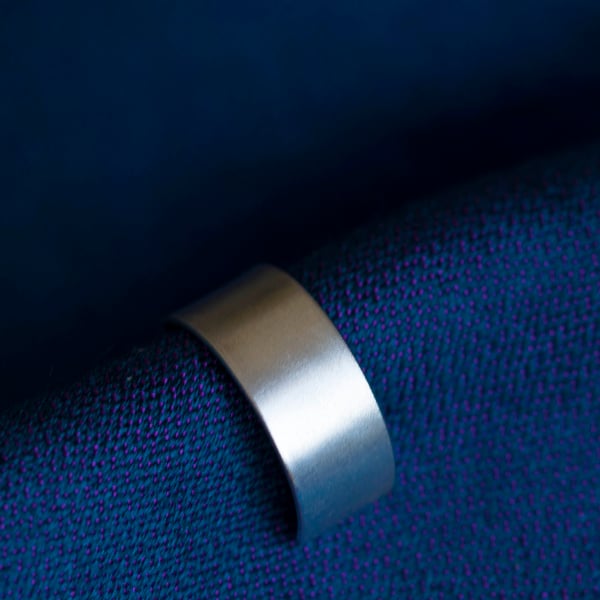 Slim silver ear cuff with a fine satin finish