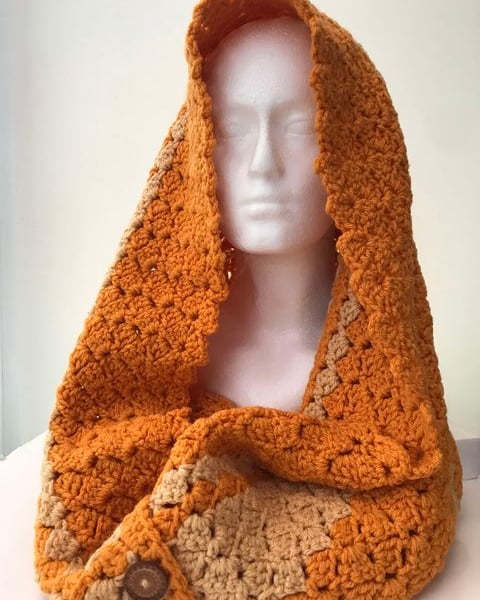Crocheted hooded scarf orange-latte 4 buttons