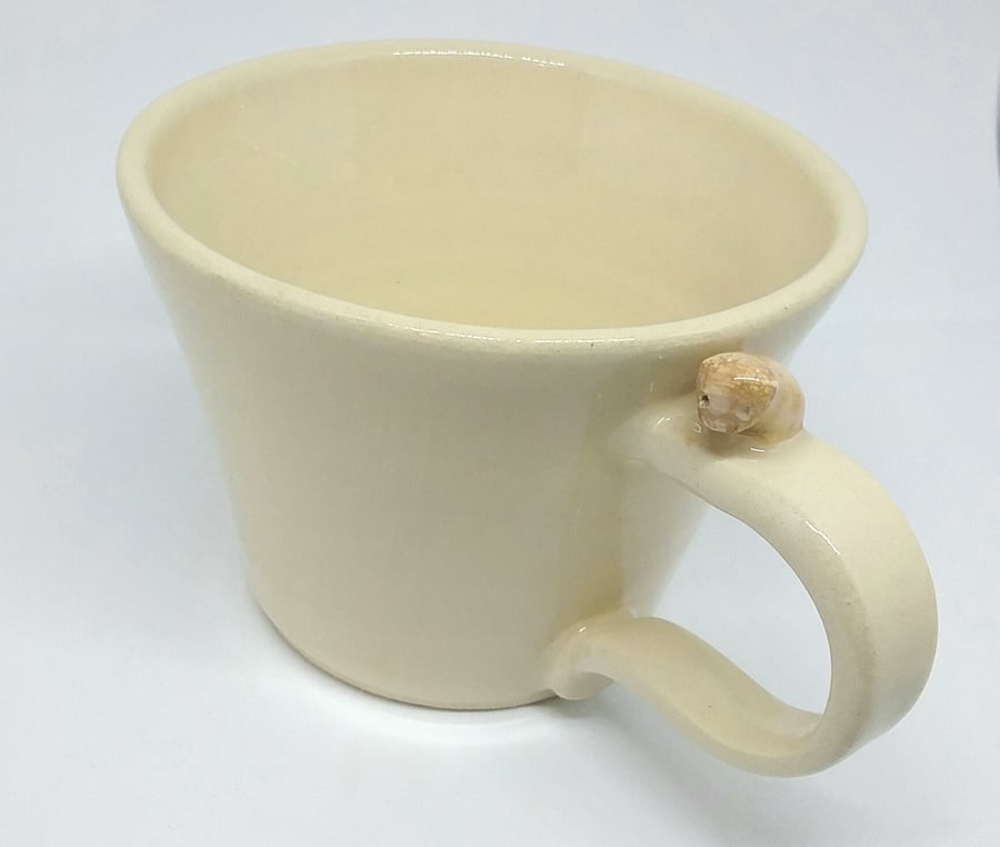 Handmade cream ceramic mug with puppy on the handle . Dog lover pottery gift cup