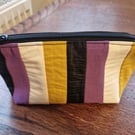 Hand sewn zip pouch made with vintage fabric.