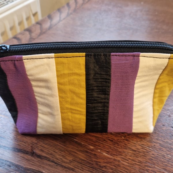 Hand sewn zip pouch made with vintage fabric.