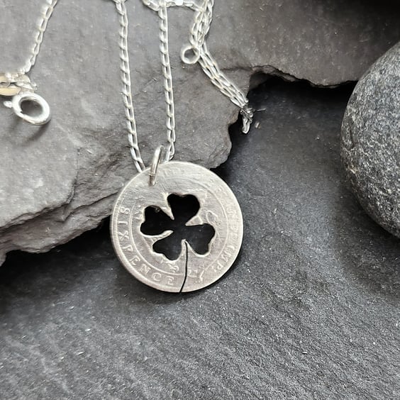 Upcycled sixpence coin pendant pierced with a shamrock
