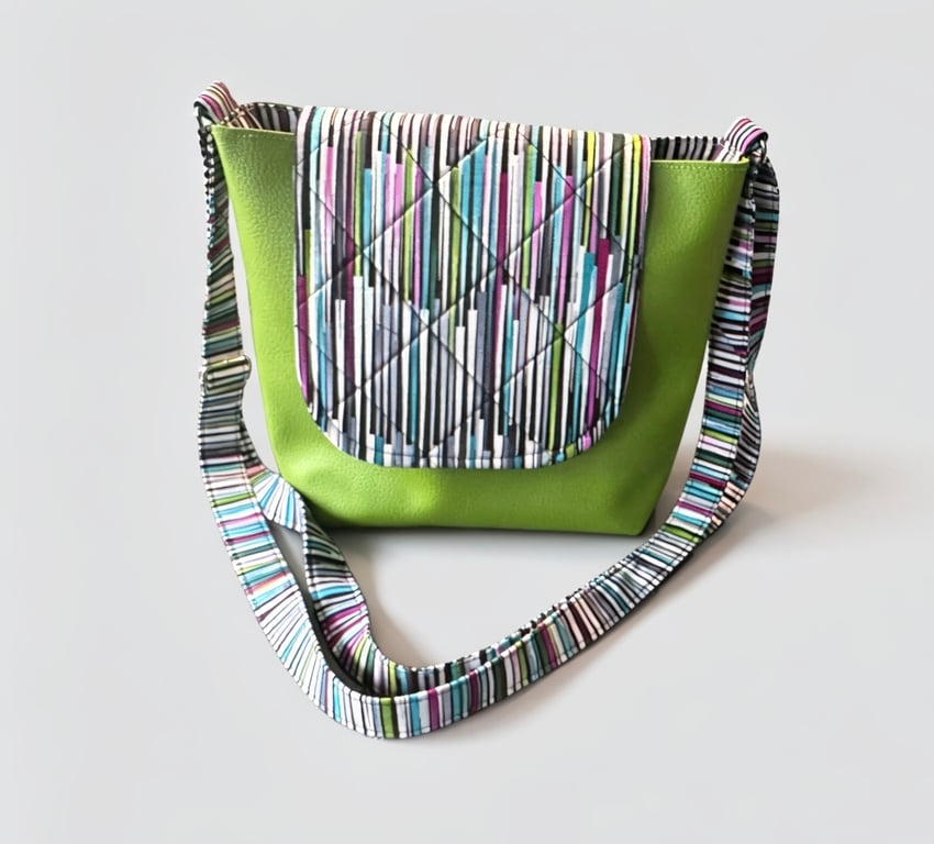 Light green messenger bag with bold colour accent.