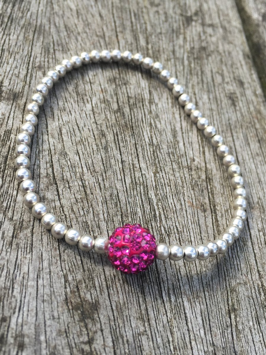 Elasticated silver plated metal beads and Fuchsia shamballa bead bracelet