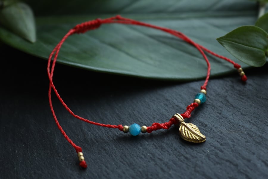 Anklet with natural stones apatite brass leaf in red