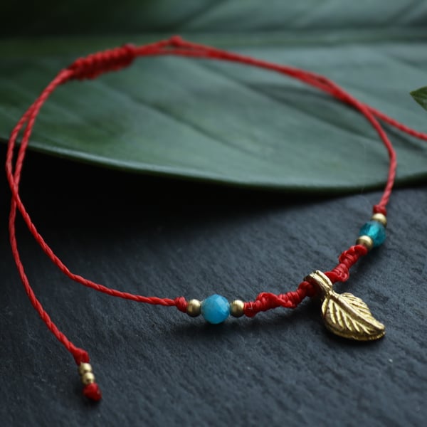 Anklet with natural stones apatite brass leaf in red