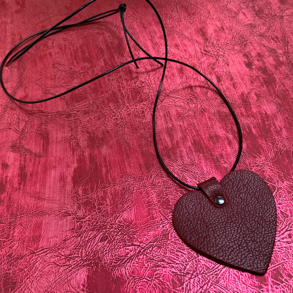 Red leather heart pendant with long leather thong