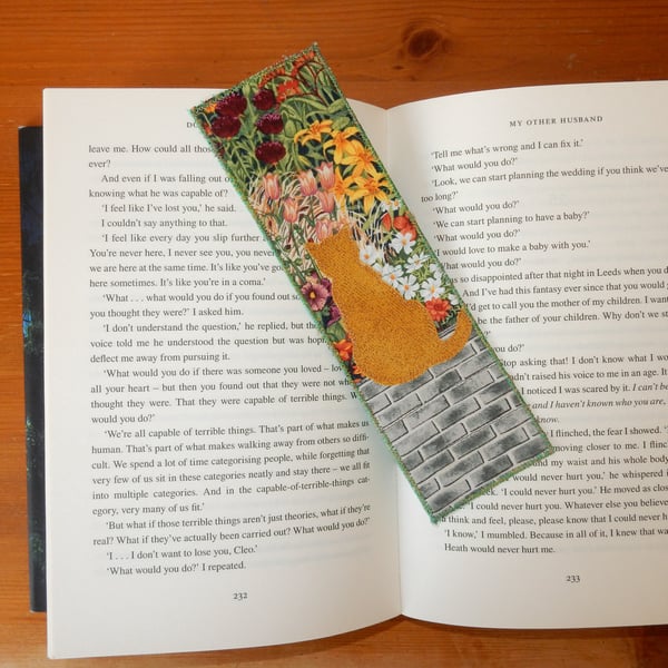 Bookmark ginger cat on the garden wall