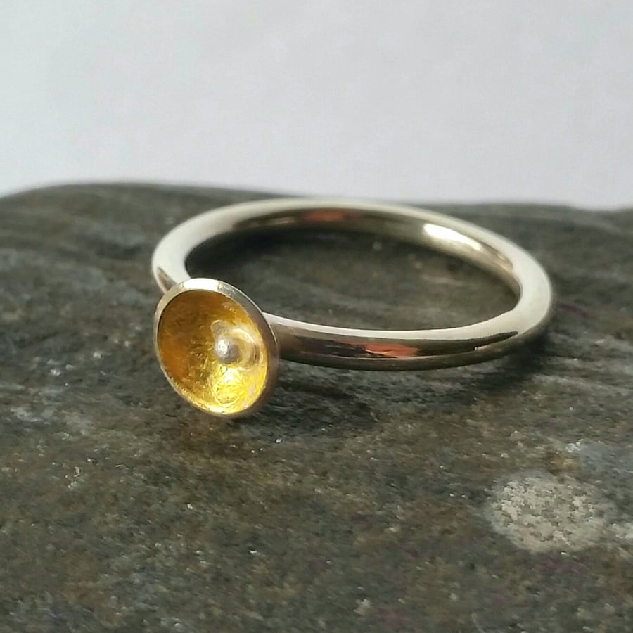 minimal sterling silver stacking ring with little gold cup and silver ball 