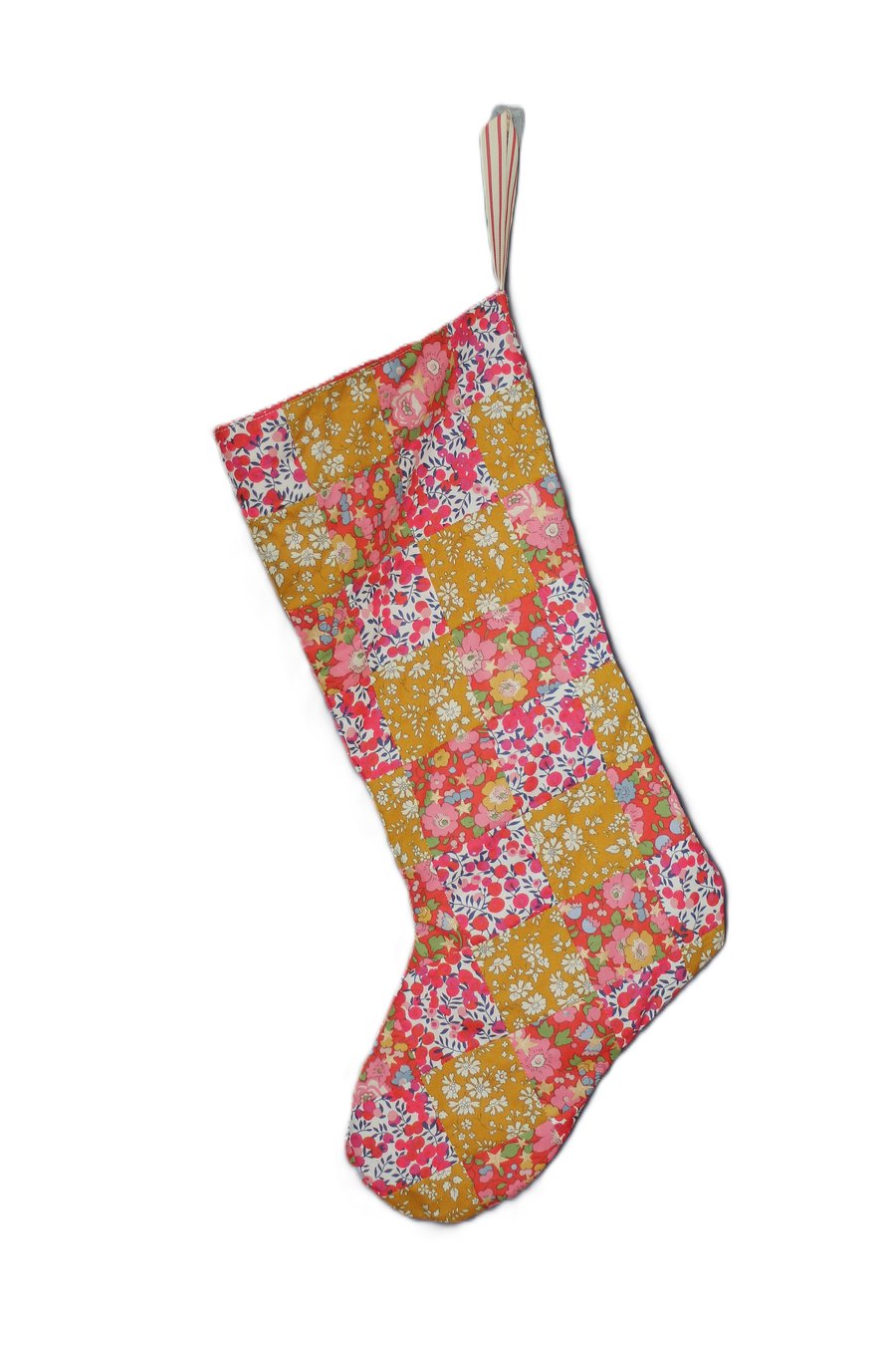 Patchwork stocking made from Liberty Tana Lawn fabric in gold, red and pink
