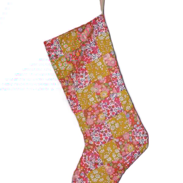 Patchwork stocking made from Liberty Tana Lawn fabric in gold, red and pink