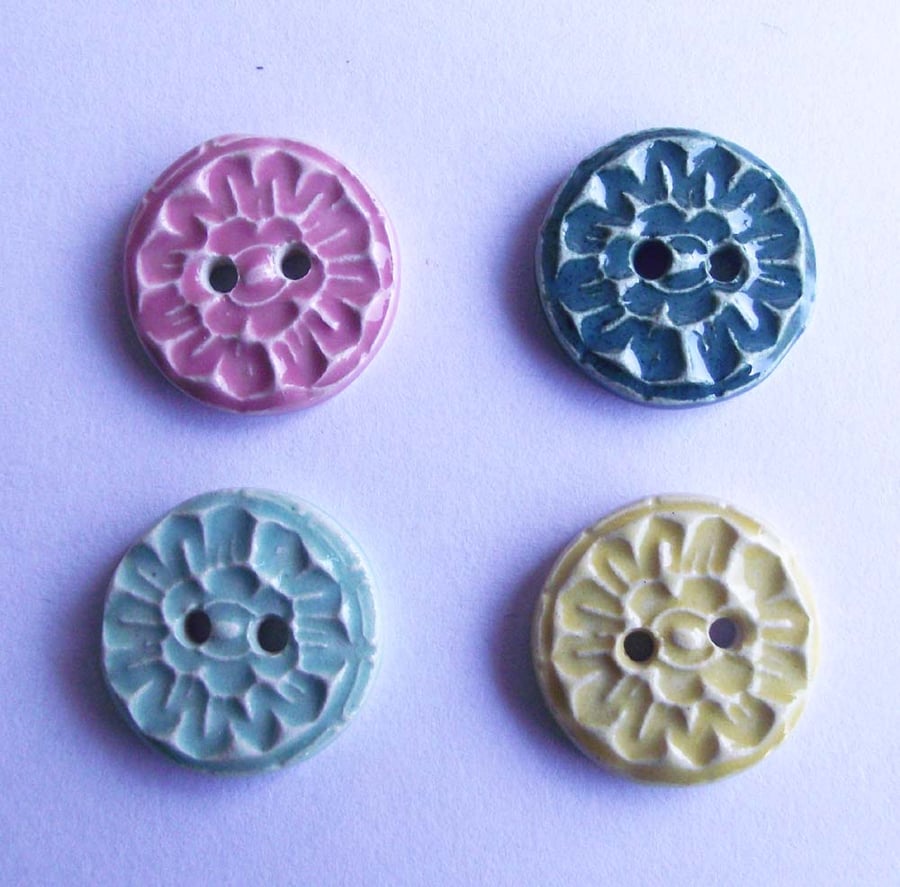Set of four little handmade ceramic buttons