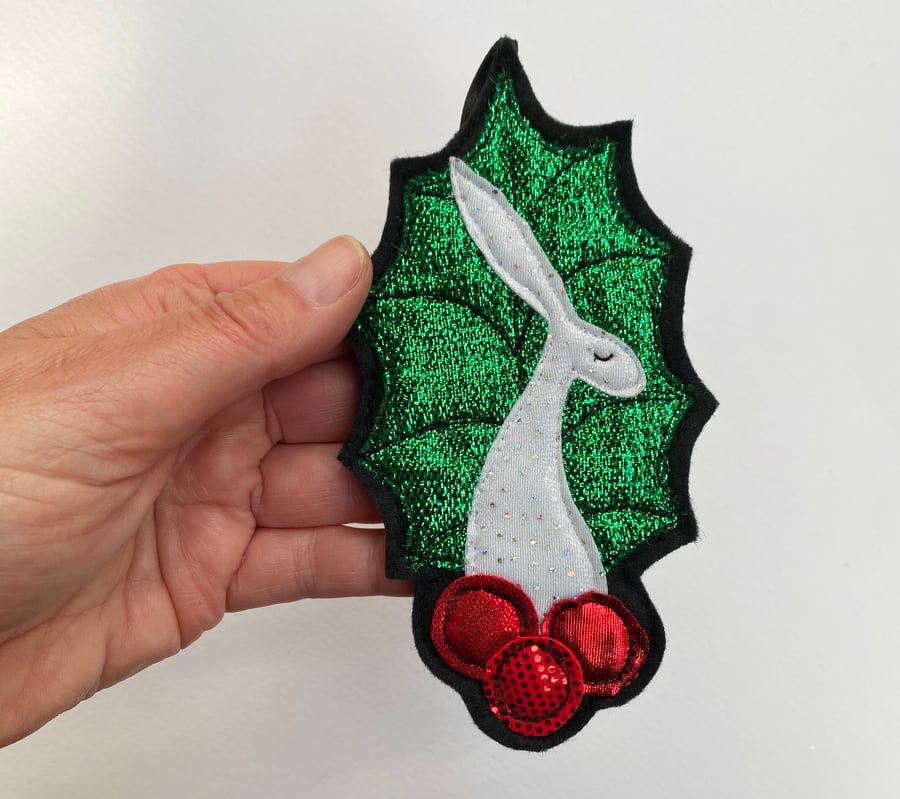 Upcycled embroidered holly leaf and berries hare home decoration. 