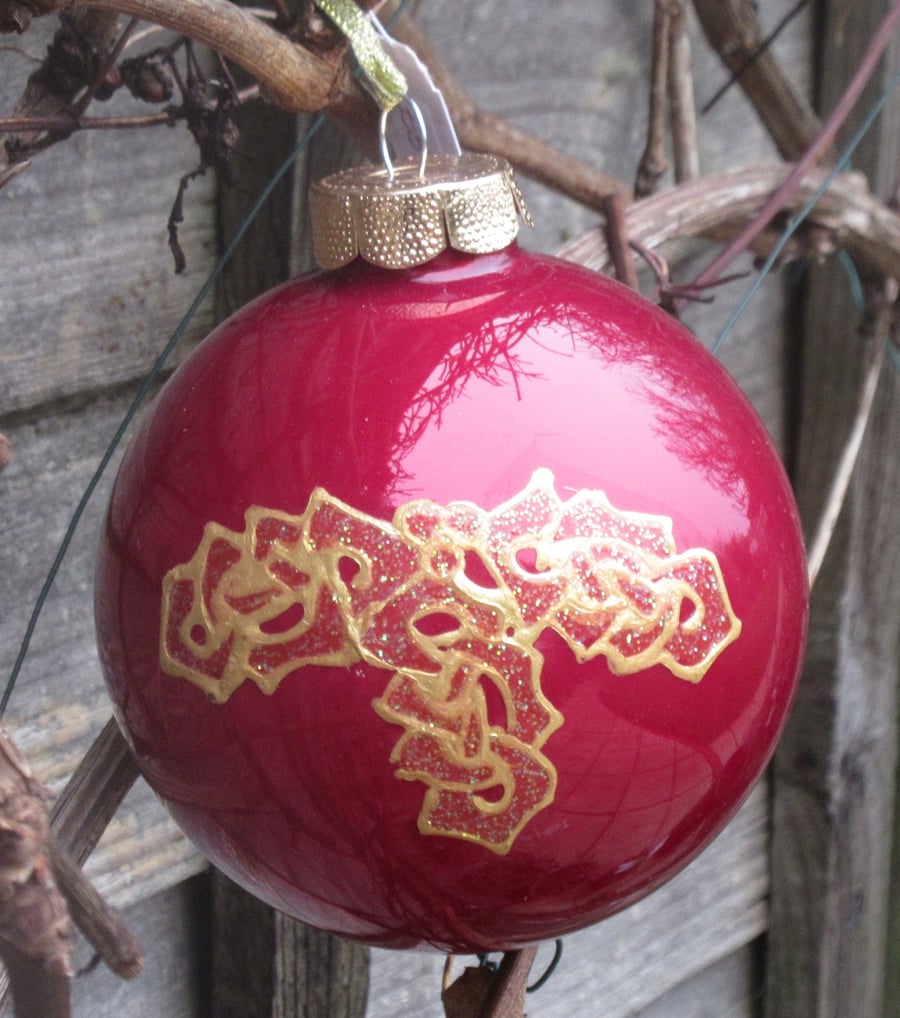 10cm Glass Red Bauble with hand painted Celtic Knot Holly Sprig with 3 leaves