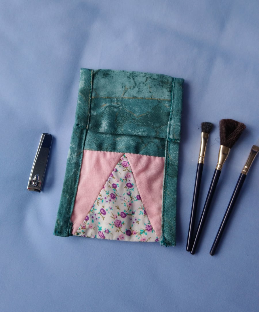 Multipurpose bag.  Mobile phone cover, cosmetics bag, make up brush storage.