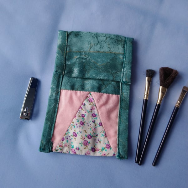 Multipurpose bag.  Mobile phone cover, cosmetics bag, make up brush storage.