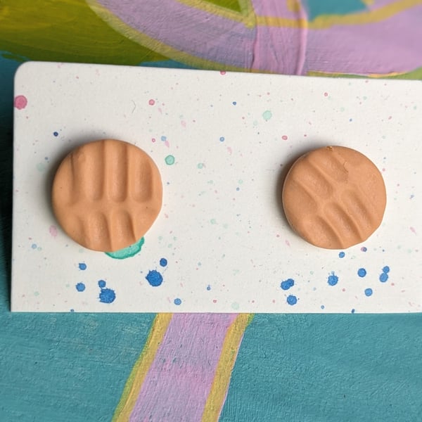 Orange textured large stud earrings. 