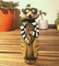 Hand carved, painted and finished wooden Reggie the Meerkat Burglar
