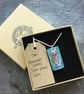 Handmade Ceramic Otter pendant in turquoise blue - Image 5