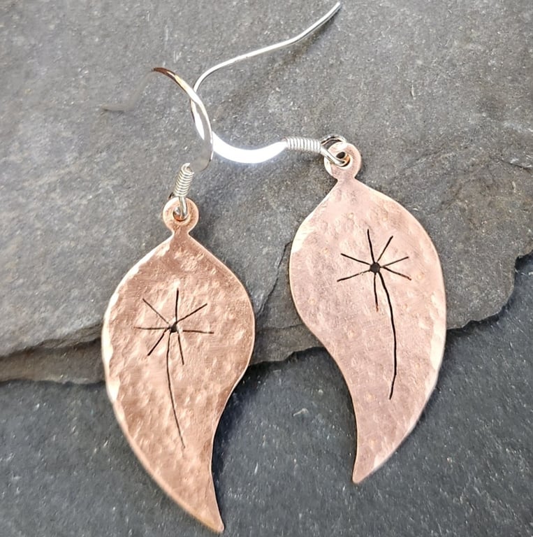 Copper leaf earrings with pierced dandelion clock design