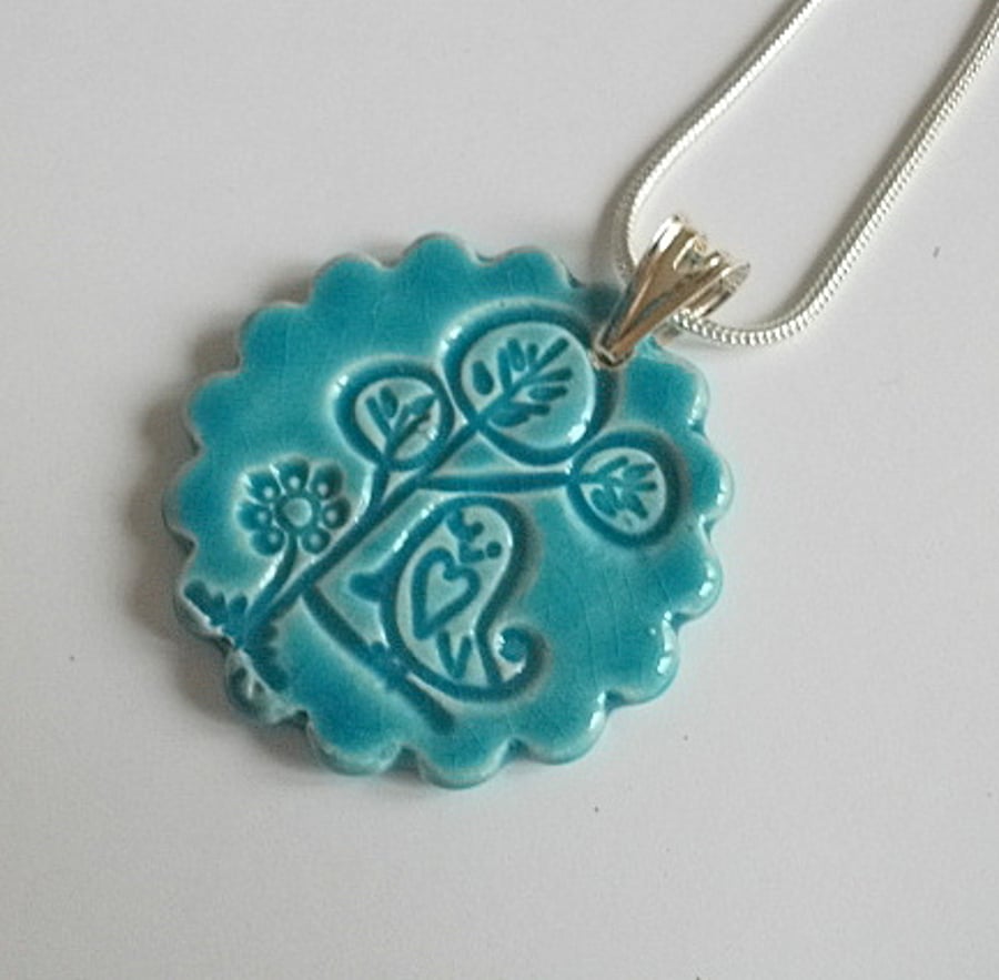 Sale - Turquoise ceramic pendant necklace impressed with bird design