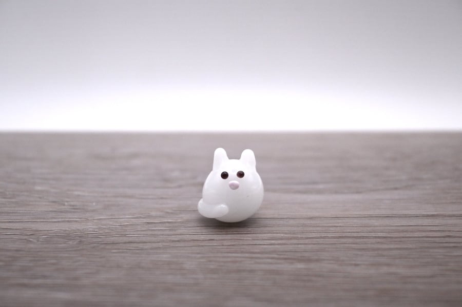 small white glass cat figure