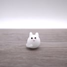 small white glass cat figure