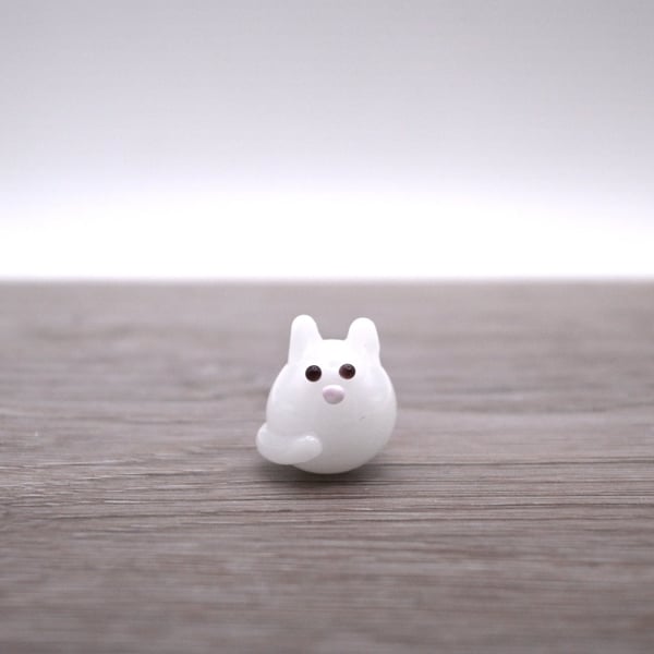 small white glass cat figure