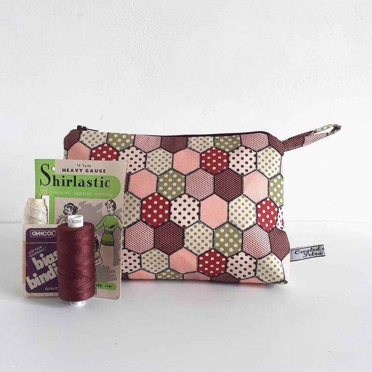 Make up or toiletries bag in a vintage patchwork print design.