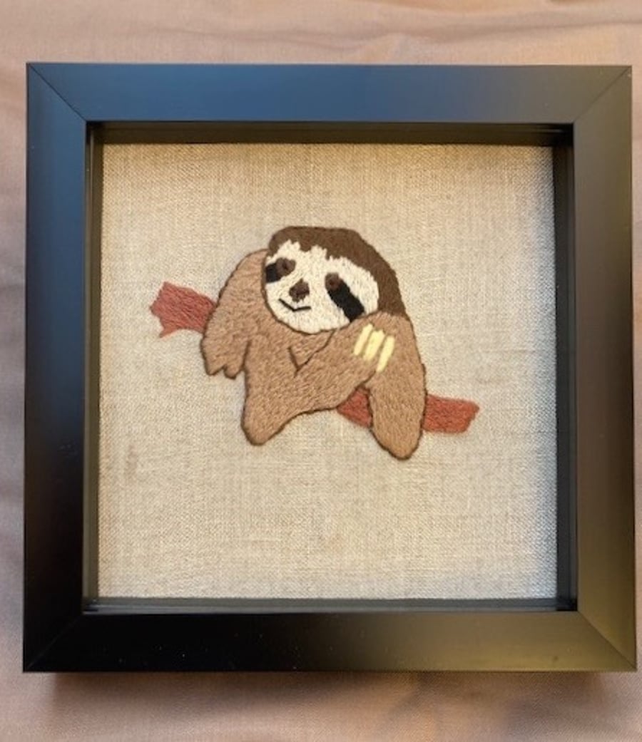 Cool, hand embroidered sloth picture.