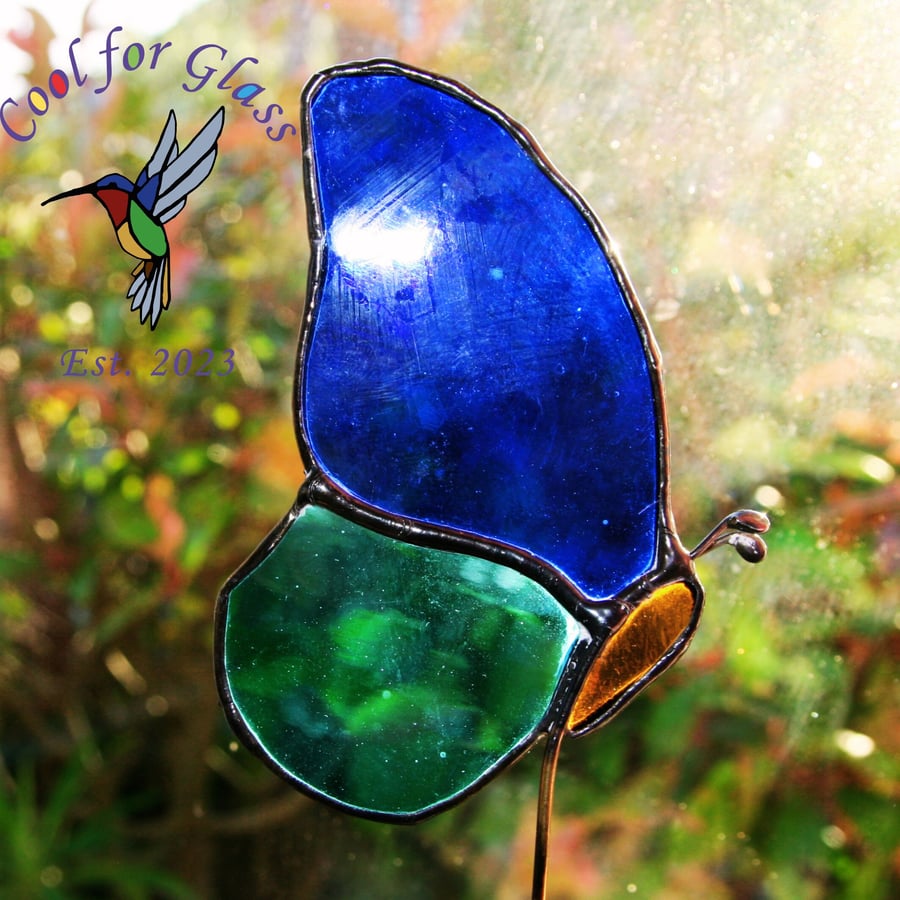 Stained glass resting butterfly plant stake