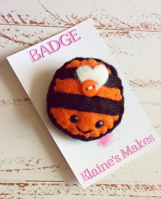 Hand sewn wool blend felt 'busy bee' badge on a printed backing card (orange)