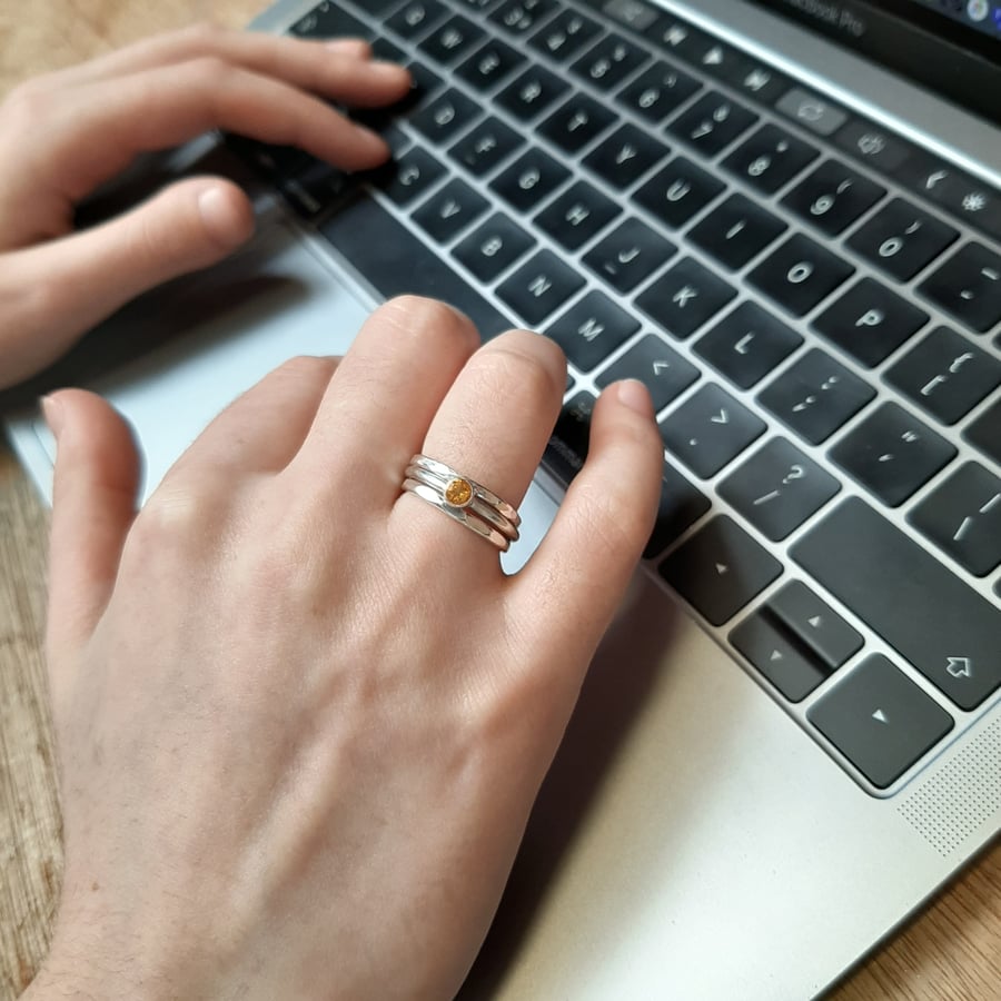 Silver stacking rings with an orange citrine ring