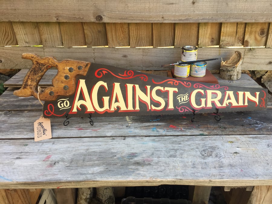 'GO AGAINST THE GRAIN' hand-painted vintage saw