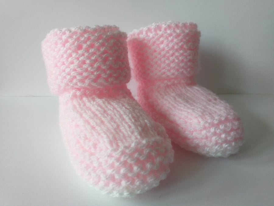 A pair ofHand knitted and  a pair of crochet baby bootees 