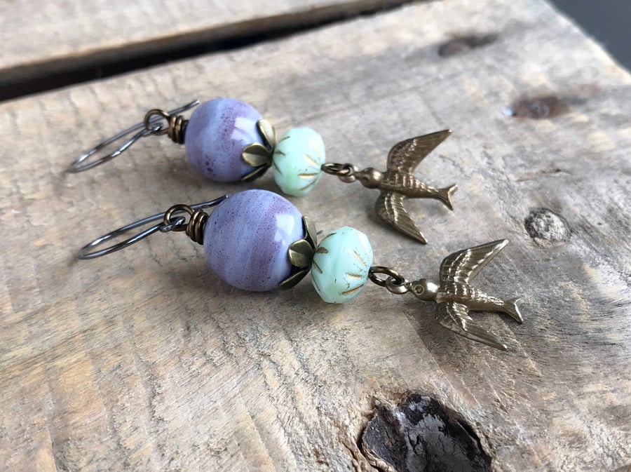 Whimsical Brass Flying Bird Earrings. Purple & Mint Green Earrings