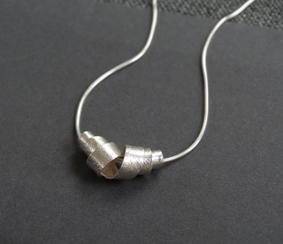 Silver birch bark scroll pendant - textured recycled silver