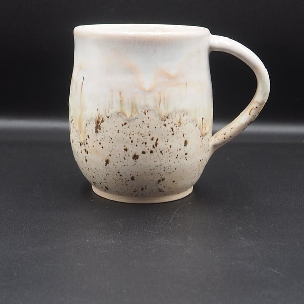 Large stoneware pottery mug finished in multi-colour brown cream glaze.
