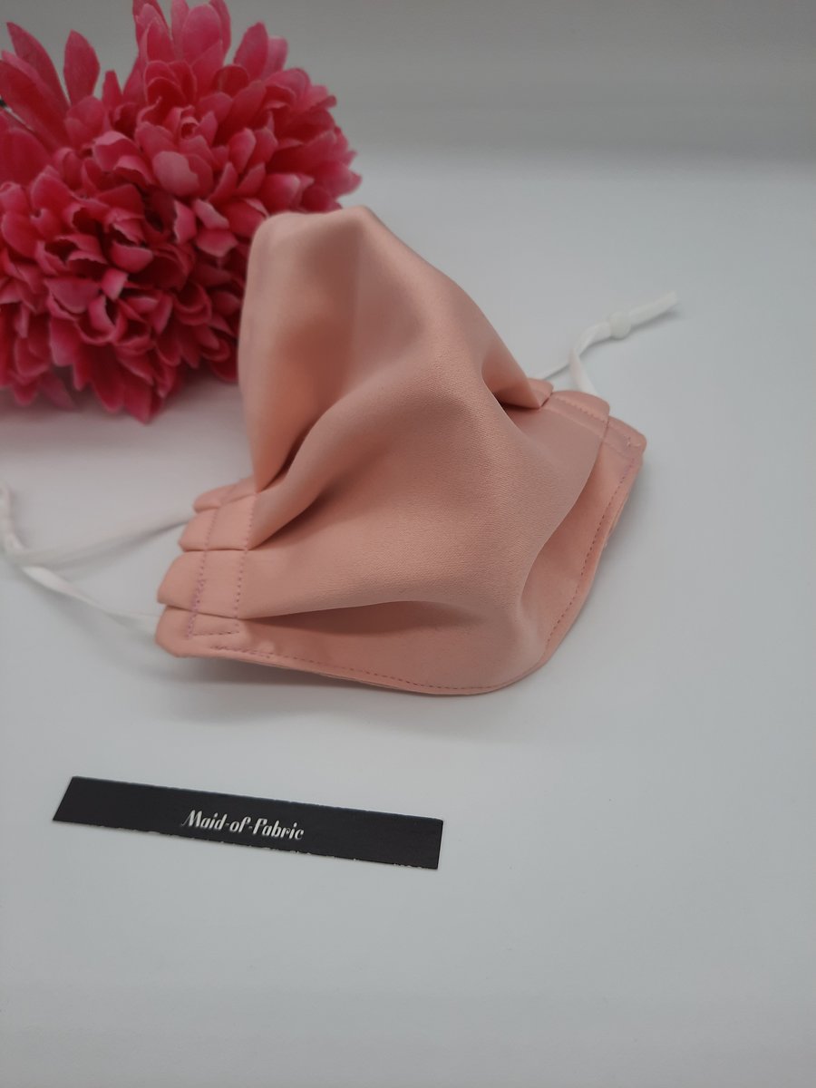Small face mask,  pink satin feel,  3 layer,  adjustable elastic.  