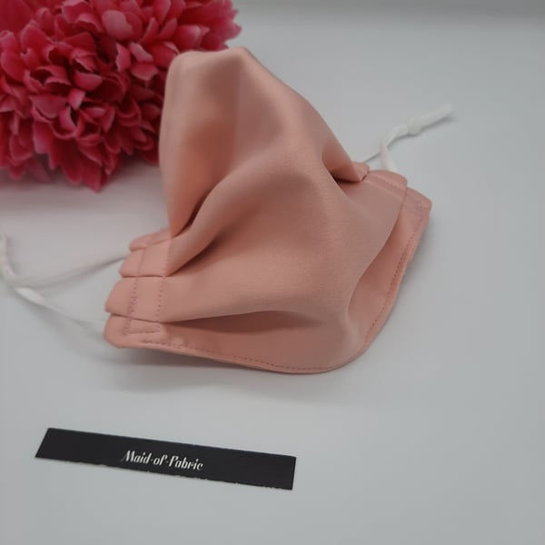 Small face mask,  pink satin feel,  3 layer,  adjustable elastic.  