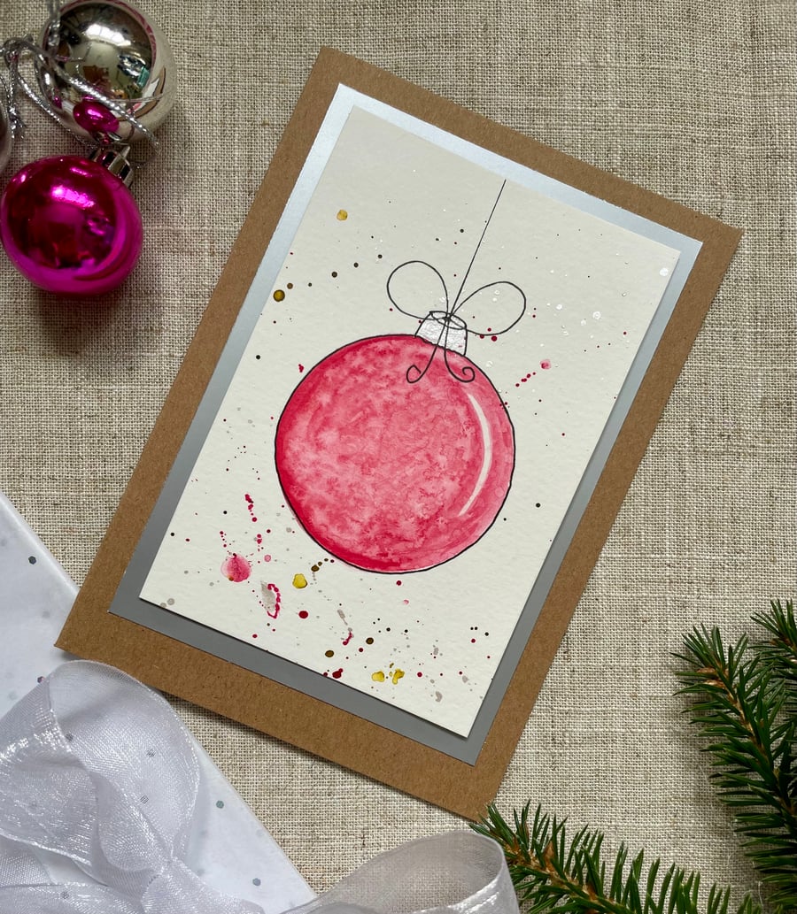 Christmas card, hand painted original of a single christmas bauble in pink.