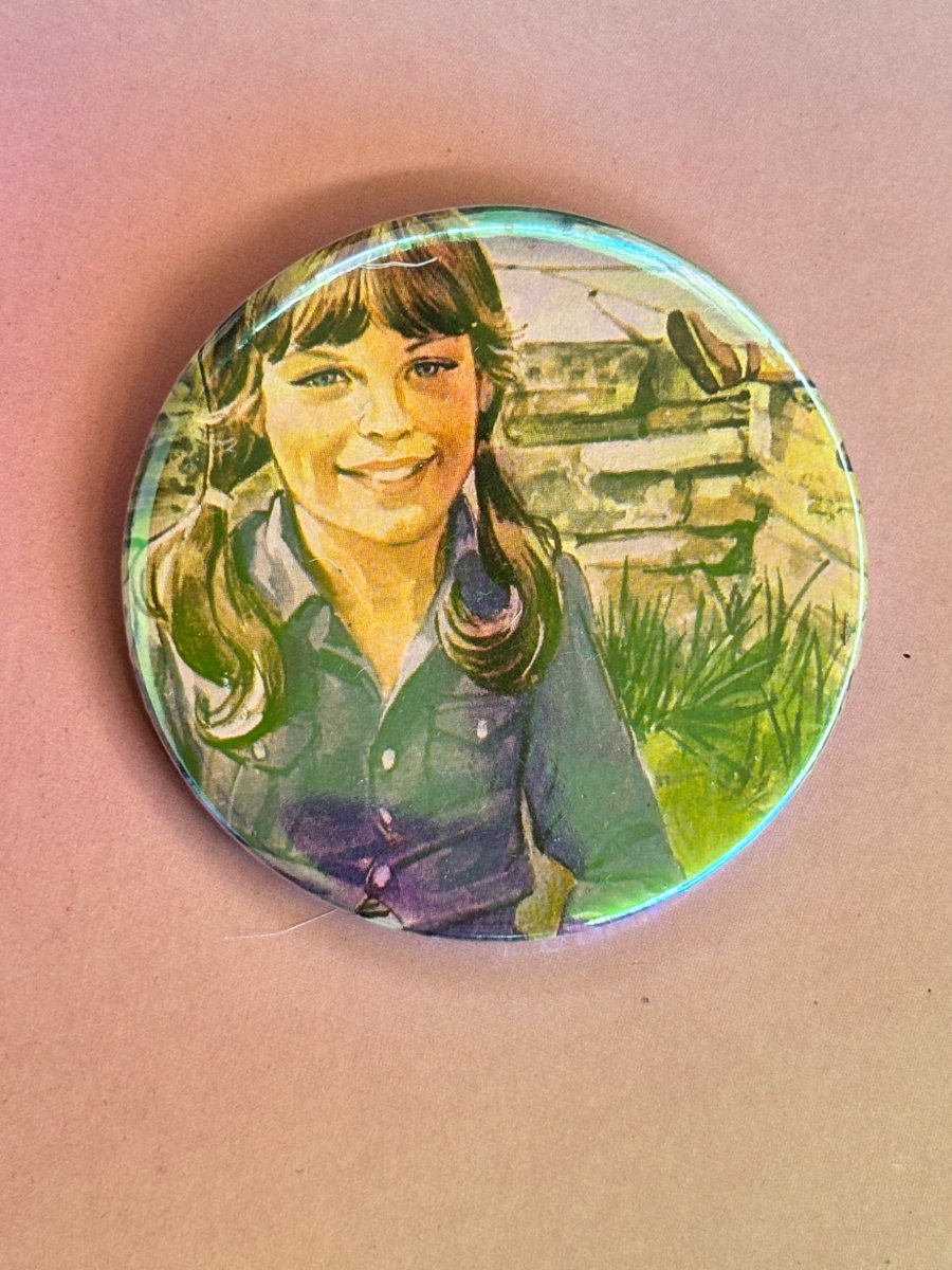 Image of Holographic vintage book pin badge - ladybird girl with pigtails