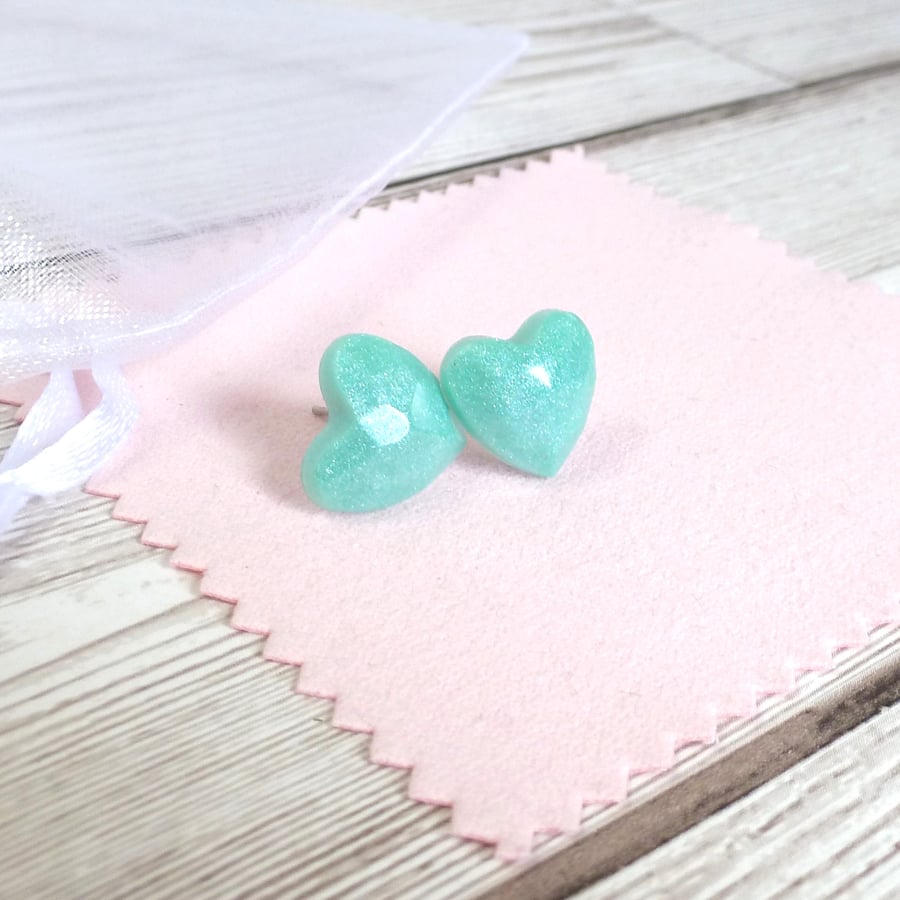 Turquoise shimmering heart studs. Pastel resin heart-shaped earrings for women