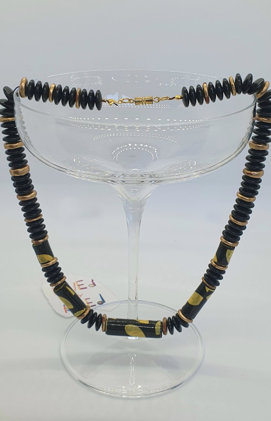 Africa inspired black yellow and gold paper beaded necklace