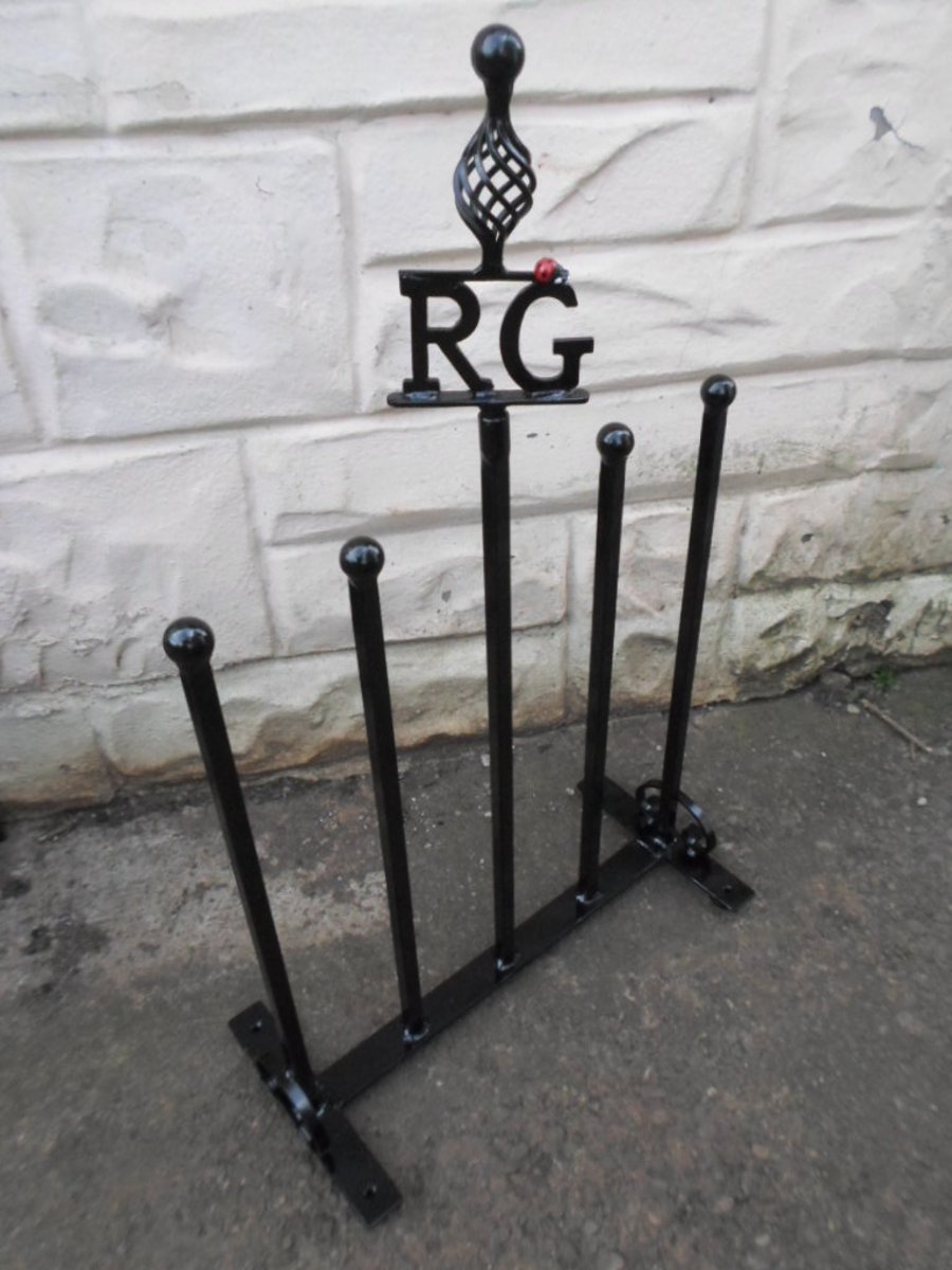 WROUGHT IRON "LADYBIRD" INITIALLED WELLIE STAND 