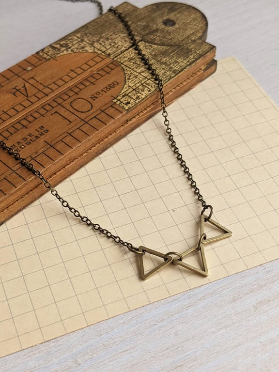 Golden Triangles charm necklace - petite triangles in a row - geometric